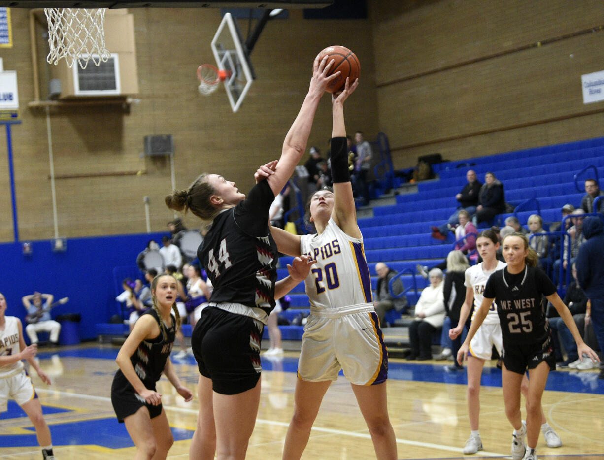 Julia Dalan (44) of W.F. West blocks the shot of Emma Iniguez of Columbia River in the 2A girls basketball district championship game at Kelso High School on Friday, Feb. 16, 2024.