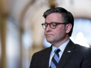 House Speaker Mike Johnson, R-La., stands outside his office during a meeting with the Speaker of the Israeli Knesset, Amir Ohana, at the Capitol in Washington, Tuesday, Feb. 6, 2024. (AP Photo/J.