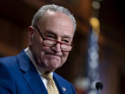 Senate Majority Leader Chuck Schumer, D-N.Y., speaks to reporters after a divided Senate passed an emergency spending package to provide send military aid to Ukraine and Israel, replenish U.S. weapons systems, and provide food, water and other humanitarian aid to civilians in Gaza, at the Capitol in Washington, Tuesday, Feb. 13, 2024. The measure has an uncertain future in the House where it is opposed by Republicans in the face of pressure from former President Donald Trump. (AP Photo/J.