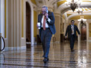 Senate Majority Leader Chuck Schumer, D-N.Y., arrives while Republicans hold a closed-door meeting after blocking a bipartisan border package that had been tied to wartime aid for Ukraine, at the Capitol in Washington, Thursday. (AP Photo/J.