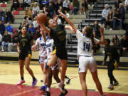 Adrian Wright of Evergreen takes a shot against Sophia Wright (14) of Mountain View in a 3A Greater St. Helens League tiebreaker girls basketball game at Camas High School on Tuesday, Feb. 6, 2024.