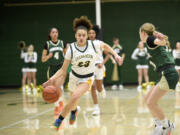 Adrian Wright (23) of Evergreen works against Hannah Jackson of Timberline in a 3A bi-district girls basketball playoff game at Evergreen High School on Friday, Feb. 9, 2024.