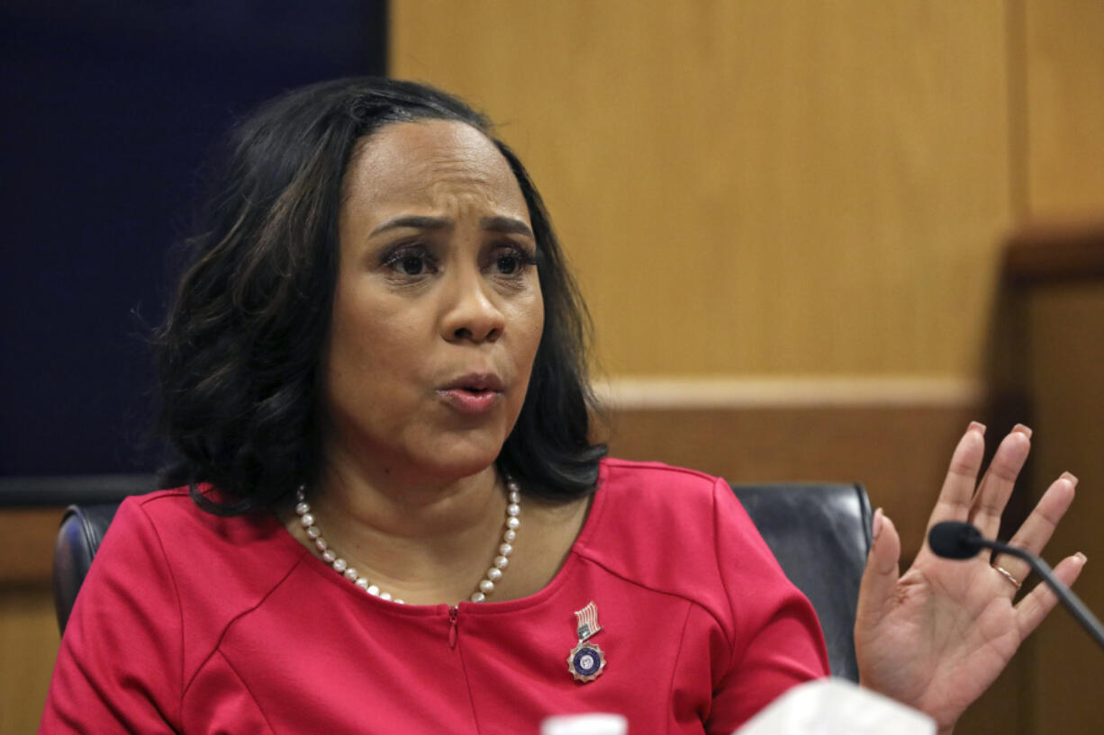 Fulton County District Attorney Fani Willis testifies during a hearing on the Georgia election interference case, Thursday, Feb. 15, 2024, in Atlanta. The hearing is to determine whether Willis should be removed from the case because of a relationship with Nathan Wade, special prosecutor she hired in the election interference case against former President Donald Trump.