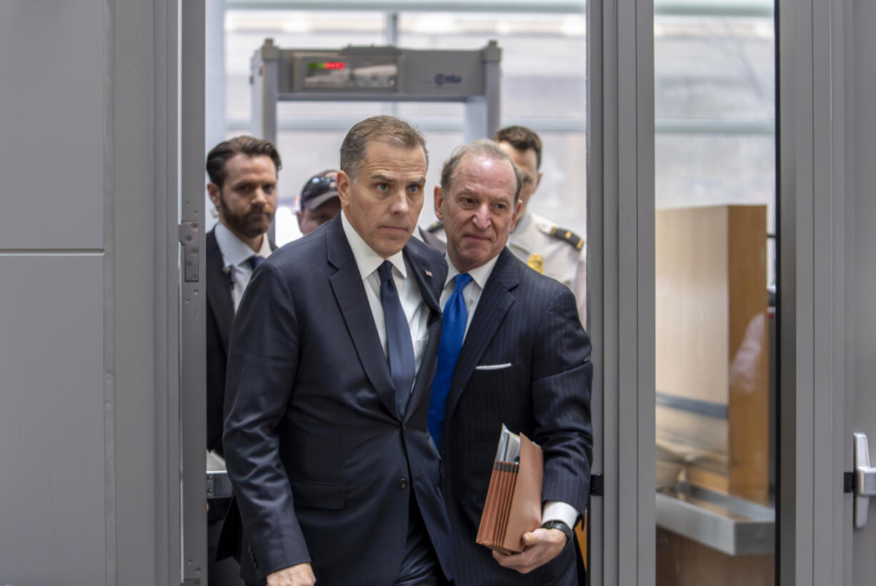 Hunter Biden, left, son of President Joe Biden, arrives with attorney Abbe Lowell at the O&rsquo;Neill House Office Building for a closed-door deposition in a Republican-led investigation into the Biden family, on Capitol Hill in Washington, Wednesday, Feb. 28, 2024. Lawmakers from the House Oversight and Accountability Committee and the House Judiciary Committee are conducting the inquiry. (AP Photo/J.