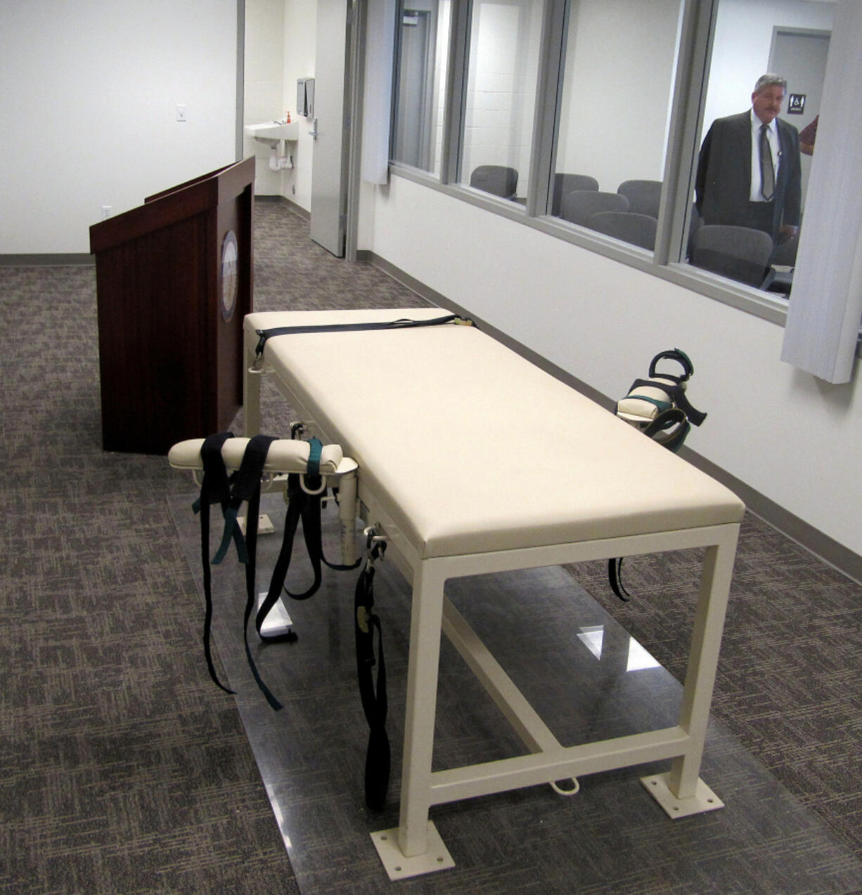 FILE - The execution chamber at the Idaho Maximum Security Institution is shown as Security Institution Warden Randy Blades look on in Boise, Idaho on Oct. 20, 2011. An Idaho man scheduled to be executed at the end of the month is asking a federal court to put his lethal injection on hold and order a new clemency hearing because the previous one resulted in a tie. Thomas Eugene Creech is Idaho&rsquo;s longest-serving death row inmate. (AP Photo/Jessie L.