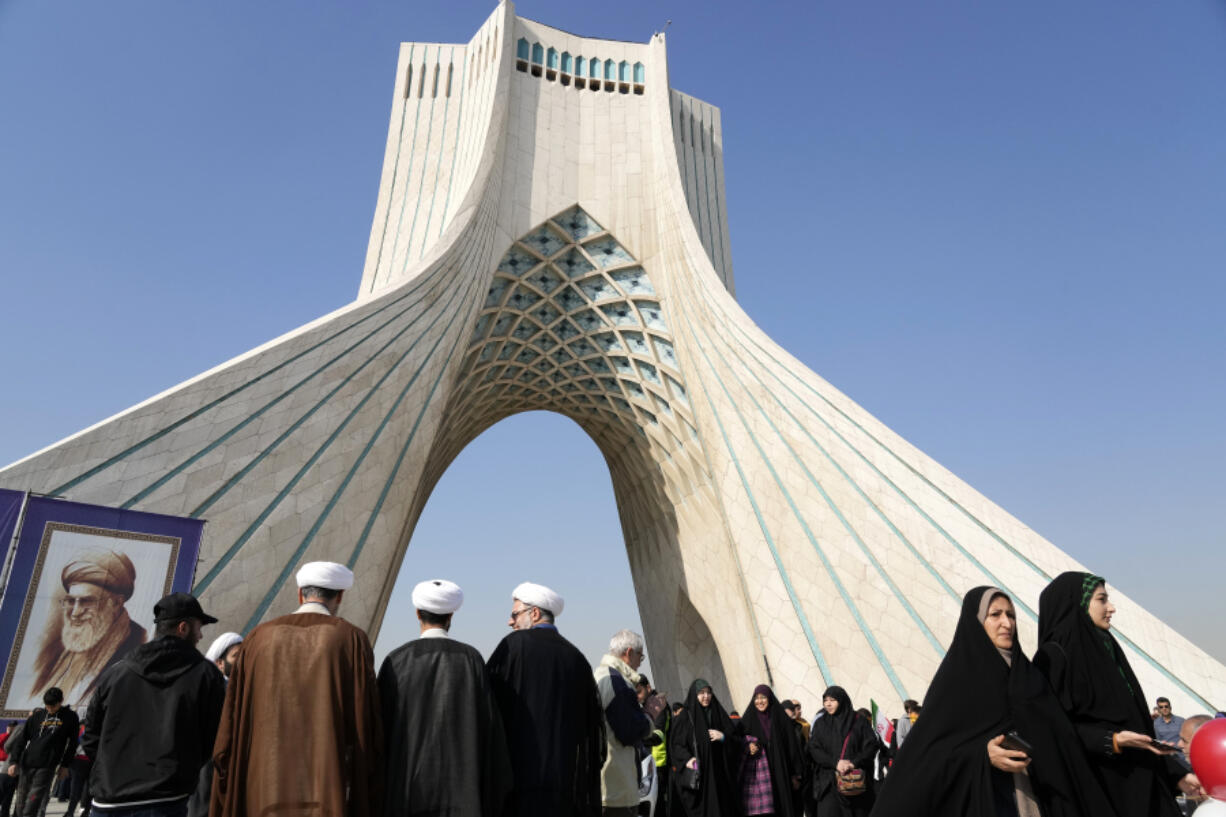 People attend the annual rally commemorating Iran&#039;s 1979 Islamic Revolution under the Azadi (Freedom) monument tower in Tehran, Iran, Sunday, Feb. 11, 2024. Iran marked Sunday the 45th anniversary of the 1979 Islamic Revolution amid tensions gripping the wider Middle East over Israel&#039;s continued war on Hamas in the Gaza Strip.