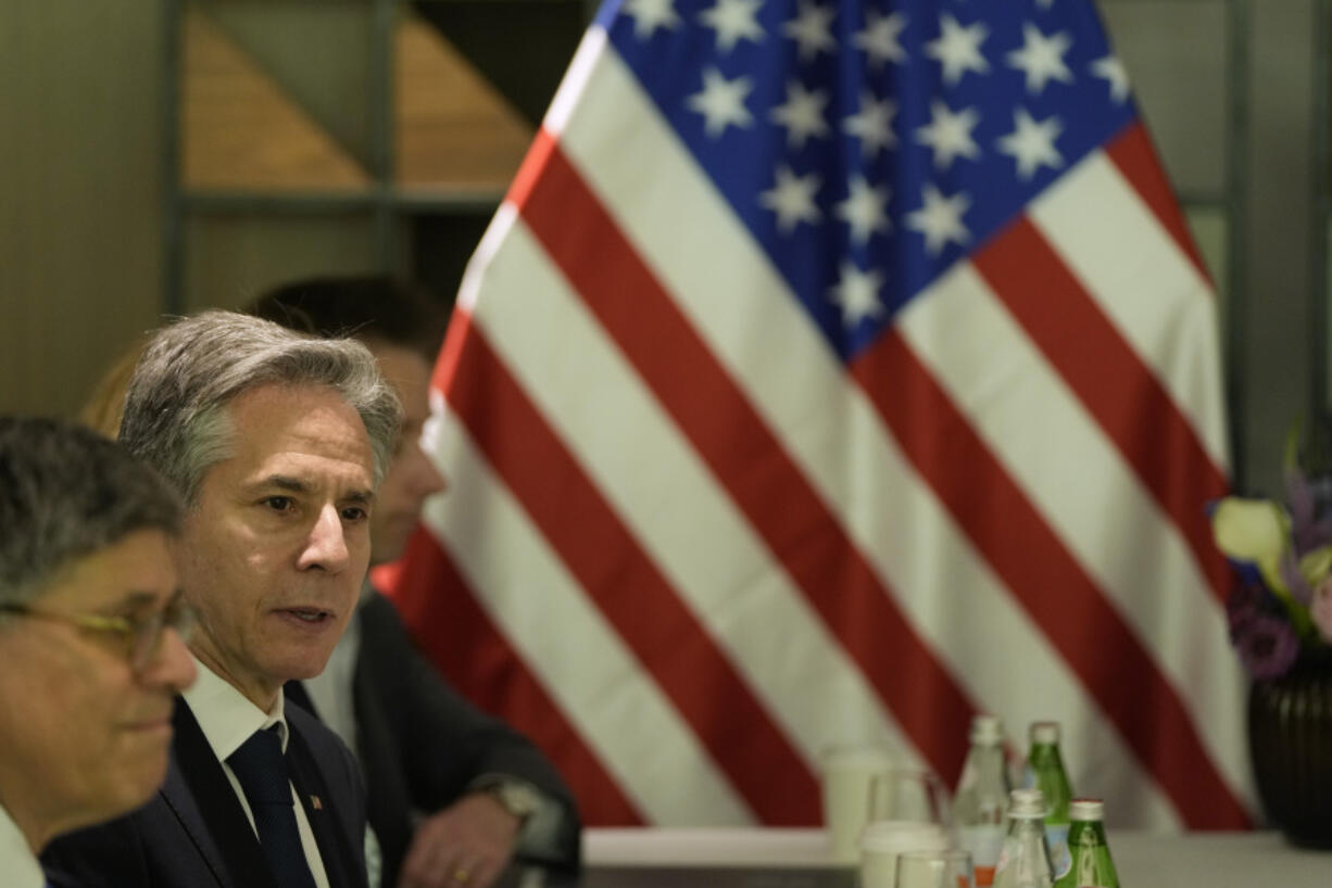 U.S. Secretary of State Antony Blinken sits across the table as he meets with former Israel Defense Forces (IDF) chief Gadi Eisenkot and former Israeli Defense Minister Benny Gantz in Tel Aviv, Israel, Thursday, Feb. 8, 2024.