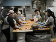 Workers roll dough as they make king cakes at Haydel&rsquo;s Bakery in Jefferson Parish, La., on Wednesday.