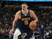 Denver Nuggets center Nikola Jokic (15) in the second half of an NBA basketball game Wednesday, Feb. 14, 2024, in Denver.