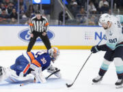 Seattle Kraken&rsquo;s Tomas Tatar, right, scores the winning goal past New York Islanders goaltender Ilya Sorokin during a shootout of an NHL hockey game, Tuesday, Feb. 13, 2024, in Elmont, N.Y. The Kraken defeated the Islanders in a shootout 2-1.