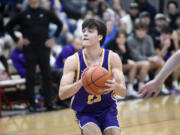 Aaron Hoey of Columbia River pulls up to shoot against Mark Morris during a 2A Greater St. Helens League boys basketball game at Mark Morris High School in Longview on Saturday, Feb. 3, 2024.