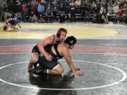 Camas junior Luke Webb wrestles in the 285-pound quarterfinals against Miguel Angel Galves of Davis at Mat Classic XXXV on Friday, Feb. 16, 2024 in Tacoma.