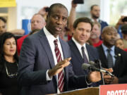 FILE - Florida Surgeon General Dr. Joseph Ladapo gestures as speaks to supporters and members of the media before a bill signing by Gov. Ron DeSantis Thursday, Nov. 18, 2021, in Brandon, Fla. Florida&#039;s controversial surgeon general is drawing criticism for his handling of an elementary school&#039;s measles outbreak, telling parents of unvaccinated children it is their choice whether their student attends class &mdash; a direct contravention of federal guidelines.