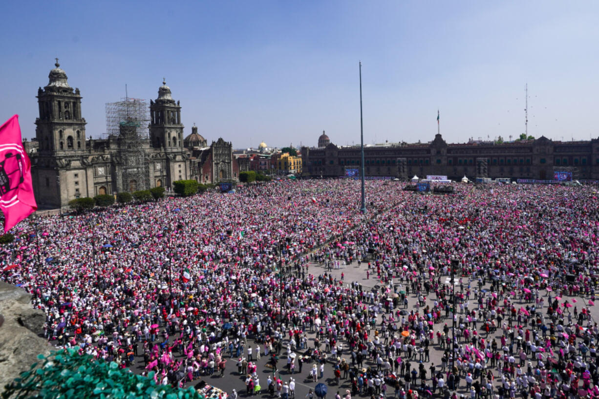 People take part in a march organized by citizen organizations demanding that electoral autonomy be respected in the upcoming general elections in downtown Mexico City. General elections in which voters will elect a new president and legislators are scheduled for June 2.