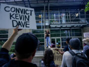 FILE - Kyla Carrillo, center, leads a chant on the steps of the Seattle Police Department&#039;s West Precinct as people protest after body camera footage was released of a Seattle police officer joking about the death of Jaahnavi Kandula, a 23-year-old woman hit and killed in January by officer Kevin Dave in a police cruiser, Thursday, Sept. 14, 2023, in Seattle. Prosecutors in Washington state said Wednesday, Feb. 21, 2024, they will not file felony charges against Seattle police officer, Dave, who struck and killed the graduate student from India while responding to an overdose call..