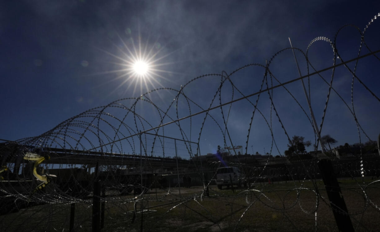 Concertina wire is stretched through Shelby Park where Texas Gov. Greg Abbott and fellow Governors held a news conference along the Rio Grande to discuss Operation Lone Star and border concerns, Sunday, Feb. 4, 2024, in Eagle Pass, Texas. Abbott returned to the Eagle Pass border to highlight his escalating attempts to curb illegal crossings on the U.S.-Mexico border.