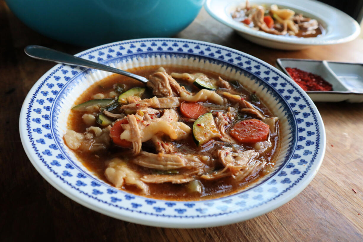 Seasoned with gochugaru, gochujang and soy sauce, this spicy chicken soup with hand-pulled noodles is packed with umami.