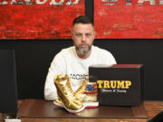 Pennsylvania resident Roman Sharf poses with his autographed Donald Trump sneakers.