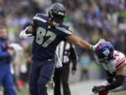 Seattle Seahawks tight end Noah Fant (87) runs against New York Giants cornerback Nick McCloud (44) during the second half of an NFL football game in Seattle, Sunday, Oct. 30, 2022.