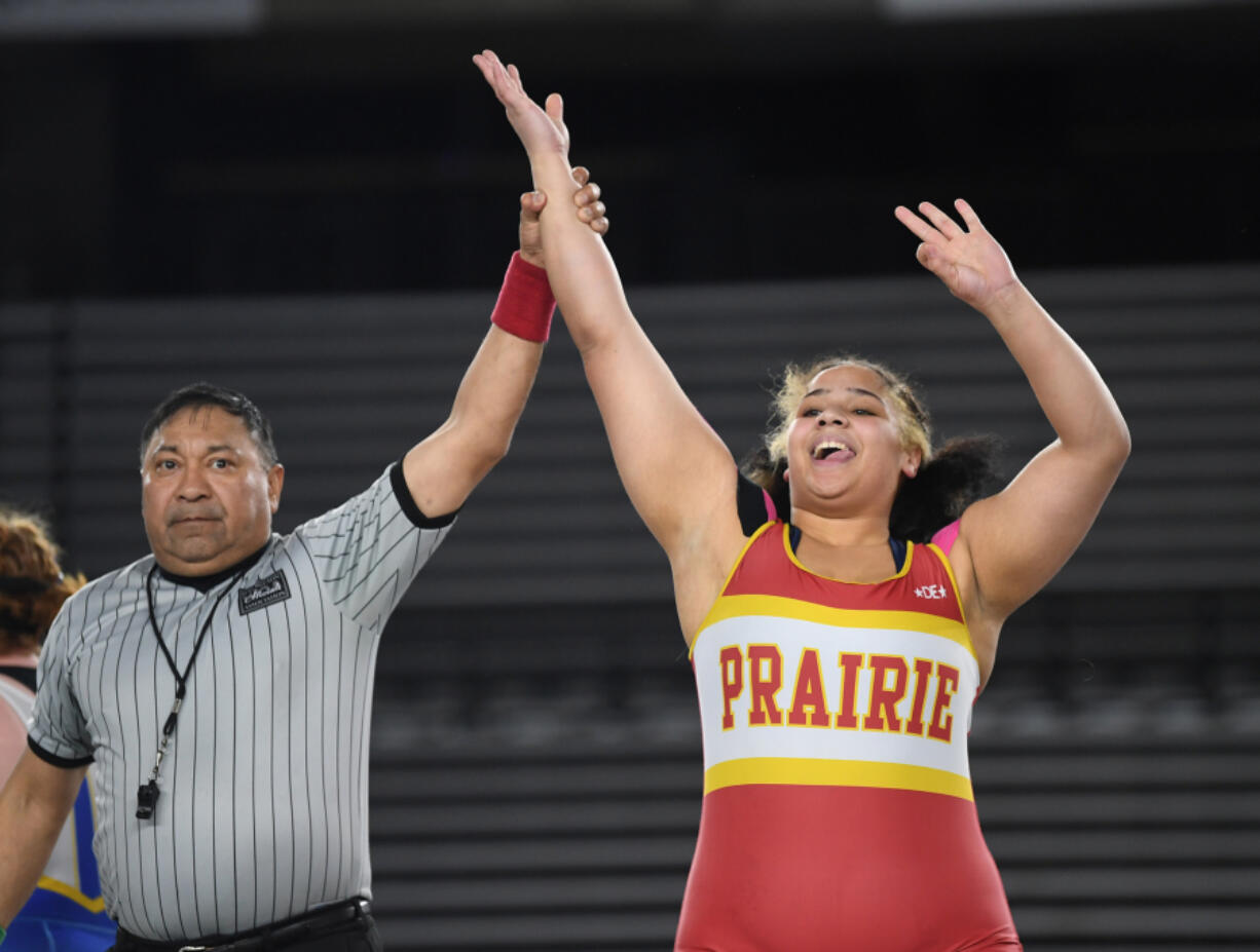 Prairie junior Faith Tarrant, right, celebrates winning the 3A/4A 235-pound championship Saturday, Feb. 17, 2024, during the Mat Classic state wrestling tournament at Tacoma Dome.