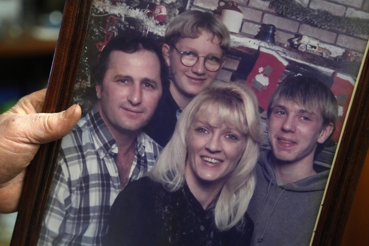 Howard Jones shows a photo of his wife Trisha Jones who was killed in 2023 when she was caught in a machine while working her job at the 3M facility in Prairie du Chien, Wisconsin, on Jan. 31, 2024, at his home in Harpers Ferry, Iowa.