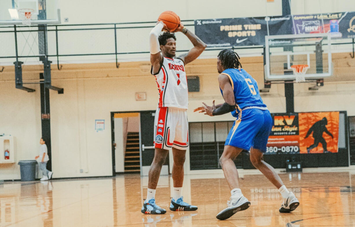 Vancouver Volcanoes wing Caleb Coleman, left, looks to pass in a game against the Great Falls Electric on Sunday, March 17, 2024 at Hudson&#039;s Bay High School. Coleman came off the bench to score 16 points and grab eight rebounds.