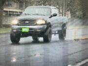 A previously taken photo of a 2001 black Ford F-150 that was reported stolen Saturday from a Hockinson house where a woman was fatally shot. The pickup has Washington license plates C73655Y. The Clark County Sheriff's Office said the occupants of the pickup should be considered armed and dangerous. Anyone who locates the pickup should call 911 and not approach the vehicle.