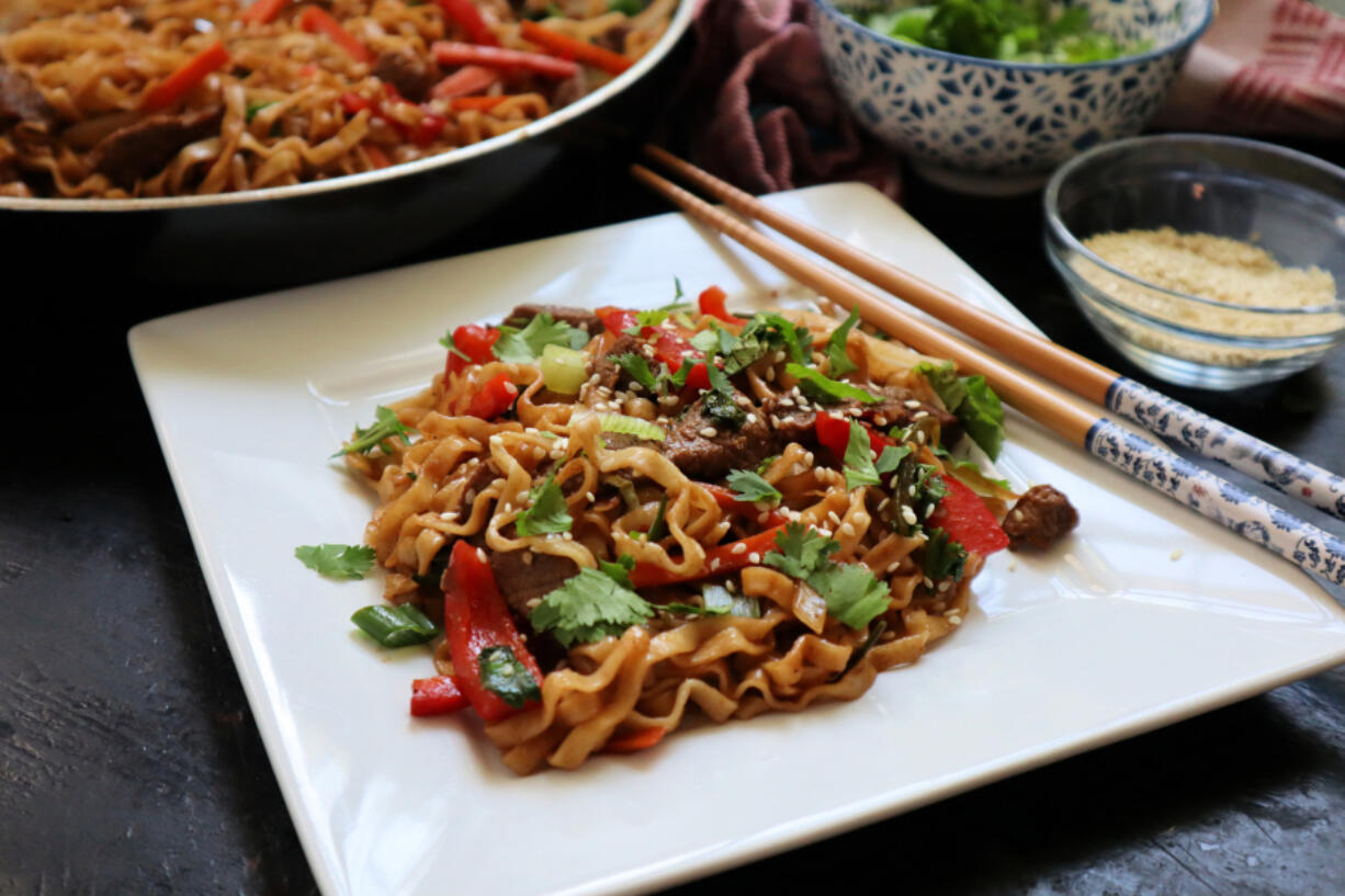 Chinese egg noodles tossed in a spicy sauce with lamb and spring vegetables is a fast and easy weeknight meal.