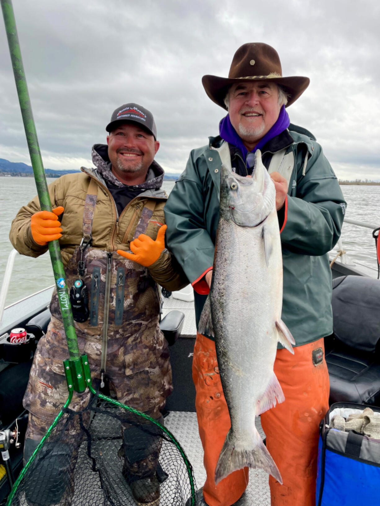 Guide Austin Moser, (left), and Buzz Ramsey with a nice lower Columbia River spring Chinook. The season for spring Chinook retention on the Columbia will close after April 5.