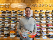 Dan Sheridan, upcoming Brooks Running CEO, is seen at the shoe wall in the the Fremont store, Tuesday, March 12, 2024, in Seattle.