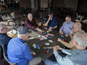 This longtime group of poker buddies has been gathering monthly for friendly, low-stakes games since 1968, first at their homes, more recently at Orchard Hills Country Club in Washougal. Clockwise around the table are Mike Cullivan (in ball cap), Jack Connolly, Phil Kalberer, Jim Kenney, Tom Skyler, Bob Haley and Alan Lee.