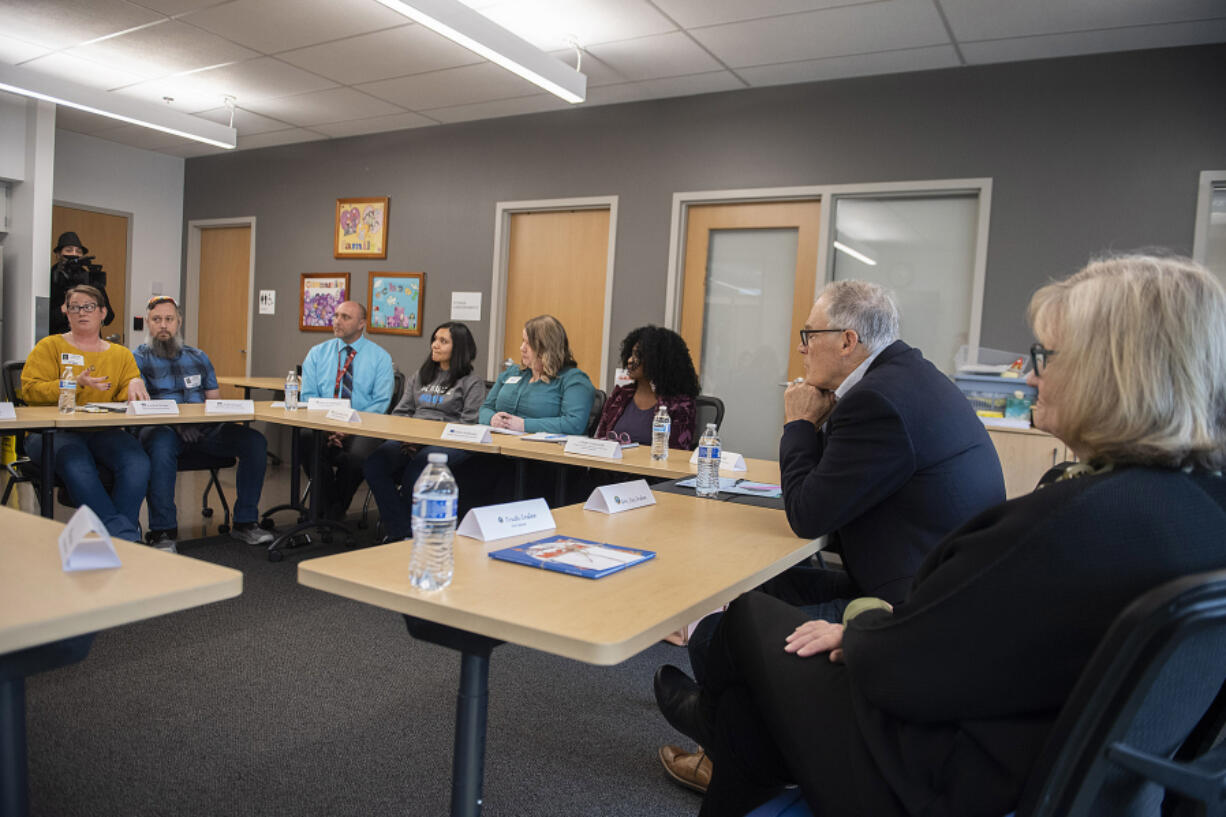 Gov. Jay Inslee, second from right, and his wife, Trudi, meet with local teachers, parents, administrators and staff to talk about special education challenges at Ogden Elementary School on Feb. 9.