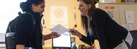 Paraeducator Michelle Dever, right, talks with Daybreak Middle School student Jayleona La Tour. Dever leads the school&rsquo;s social and emotional learning center.