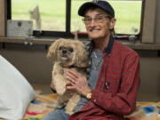 Kathy Driver holds her 11-year-old Shih Tzu Cooper. Driver&rsquo;s spouse died in 2022, and she could no longer stay in the home they shared.