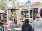 Patrons dine at the Carts by the Park food cart pod Thursday in Ridgefield.