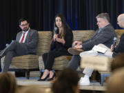 David Adkins, a senior engineering manager at Meta, from left, listens to fellow panelist Krystal Daibes Higgins, vice president of equity research at Ferguson Wellman, with Dave Barcos, director of business development at Formos, and Will Campbell, associate editor at The Columbian, on Tuesday, March 5, 2024, at The Columbian&Ccedil;&fnof;&Ugrave;s annual Economic Forecast Breakfast at Hilton Vancouver.