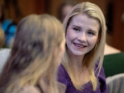 Kidnapping survivor Elizabeth Smart chats with guests Friday at the Java For Justice Brunch. Smart was abducted in 2002 from her Salt Lake City home and held captive for nine months before she was rescued.