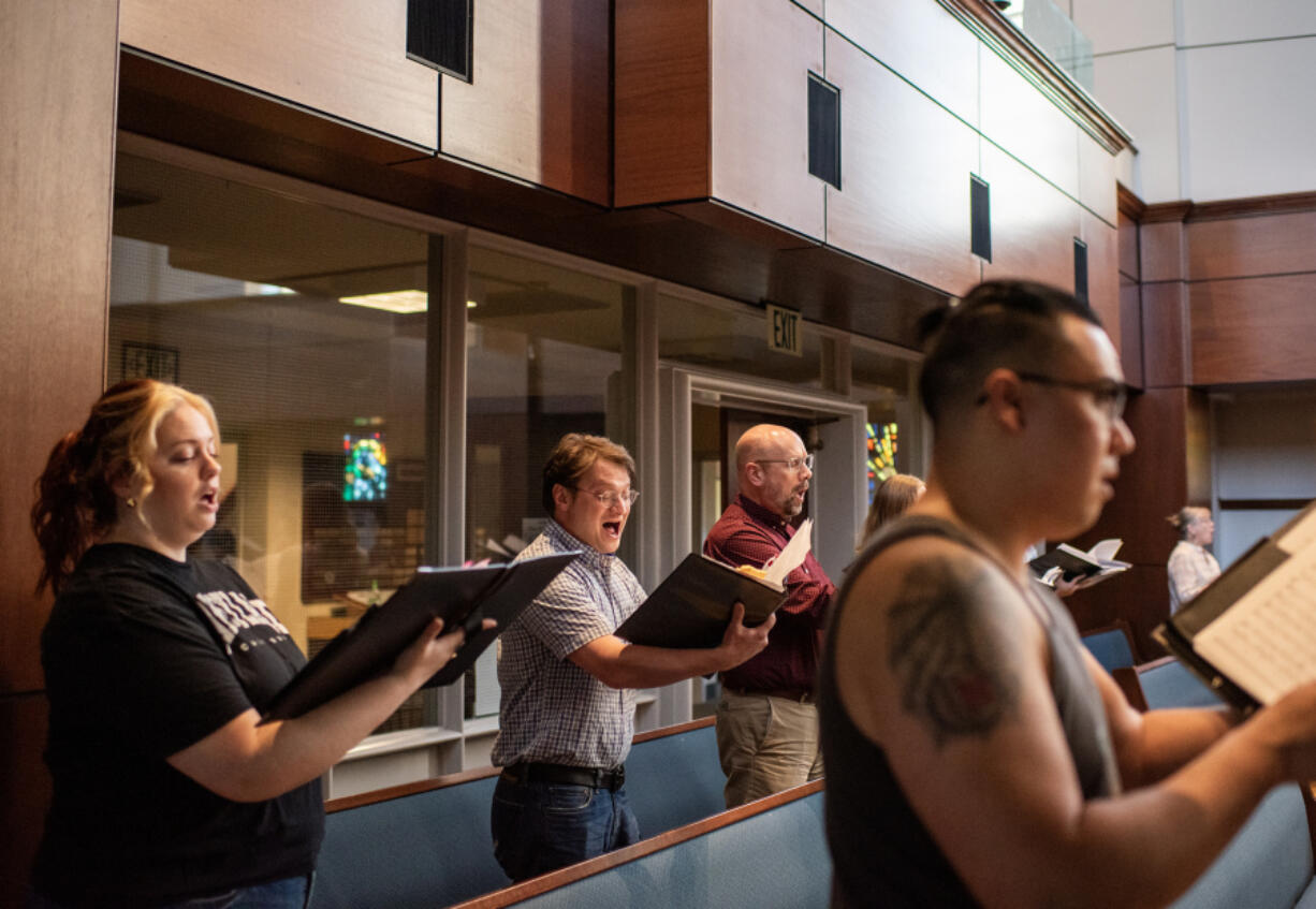 Members of Reprise Choir rehearse on a recent Monday night.