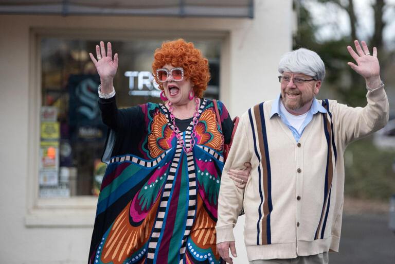 Renee and Tom Martin of Cornelius, Ore., greet fellow participants while dressed as Helen and Stanley Roper during Saturday evening&rsquo;s Mrs.