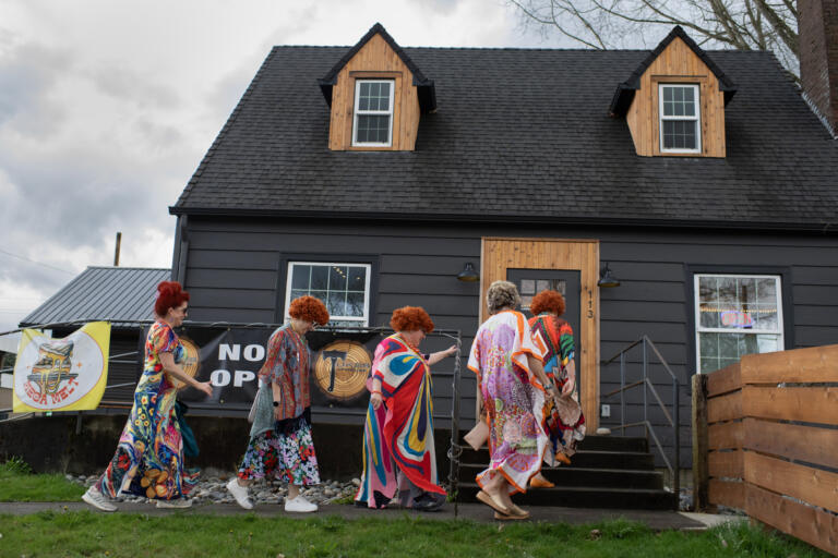 Participants swing by Tukes Taphouse during the Mrs. Roper Pub Crawl in downtown Battle Ground on Saturday evening, March 23, 2024.