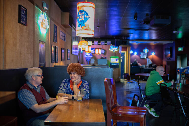 Glenn and Kirsten Gephart of Battle Ground stop by Main Street Bar for a drink while dressed as Stanley and Helen Roper during Saturday evening&rsquo;s Mrs.