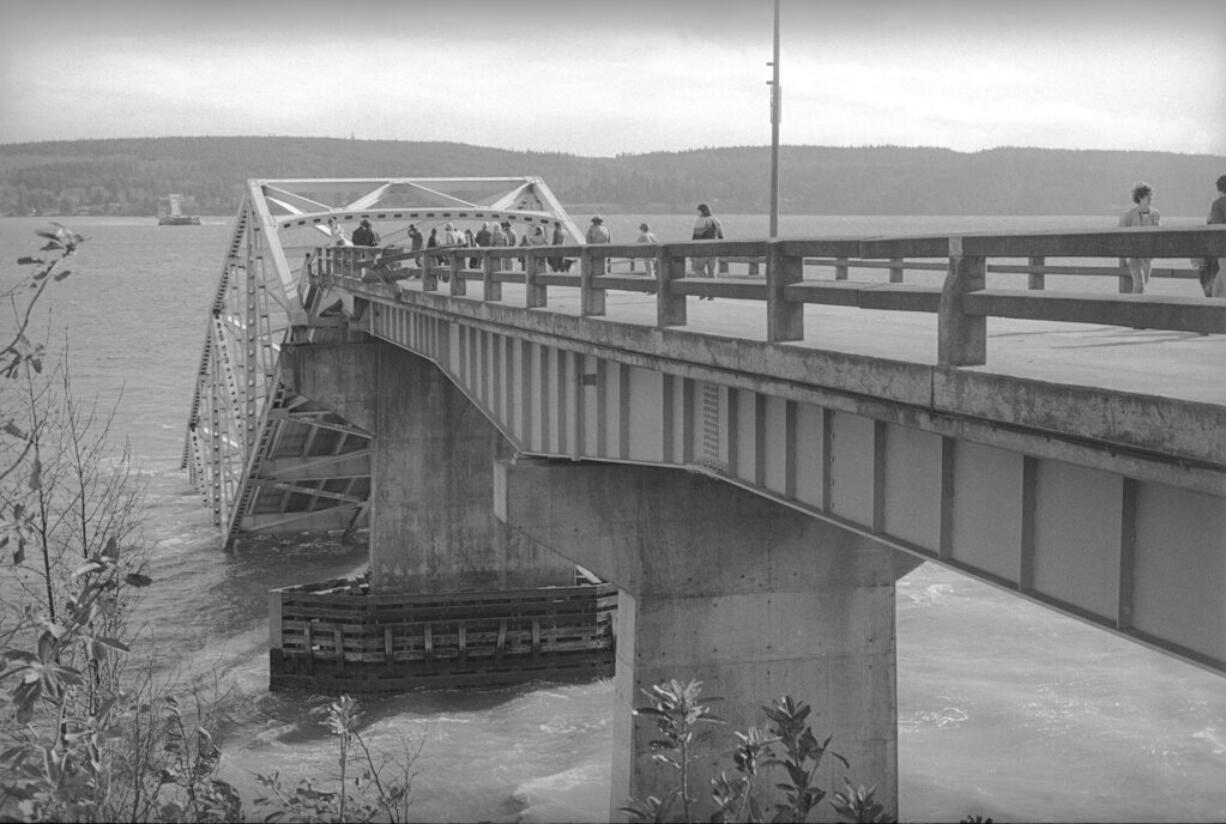 The west end of the Hood Canal Floating Bridge at Port Gamble sinks into the water after a windstorm destroyed the 1.3 mile link between Washington's Kitsap Peninsula and the Olympic Peninsula, Feb.