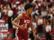 Washington State forward Jaylen Wells gestures after scoring during the first half of an NCAA college basketball game against UCLA, Saturday, March 2, 2024, in Pullman, Wash.