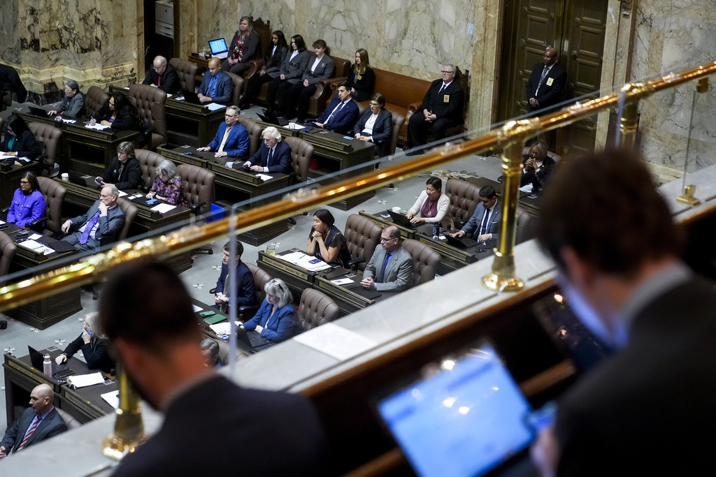 FILE - People watch House floor proceedings from the gallery on the first day of the legislative session at the Washington state Capitol, Monday, Jan. 8, 2024, in Olympia, Wash. In a busy, 60-day Washington state legislative session, lawmakers made bipartisan strides to address the opioid crisis and tweak policing practices but fell short in getting some of the most anticipated progressive bills across the finish line. The session ended Thursday, March 7 with over 300 bills heading to Democratic Gov. Jay Inslee's desk.