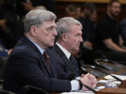 Retired Gen. Mark Milley, left, the former chairman of the Joint Chiefs of Staff, left, and retired Gen. Kenneth McKenzie, former commander of the U.S. Central Command, speak to the House Foreign Affairs Committee about the U.S. withdrawal from Afghanistan, at the Capitol in Washington, Tuesday, March 19, 2024. (AP Photo/J.