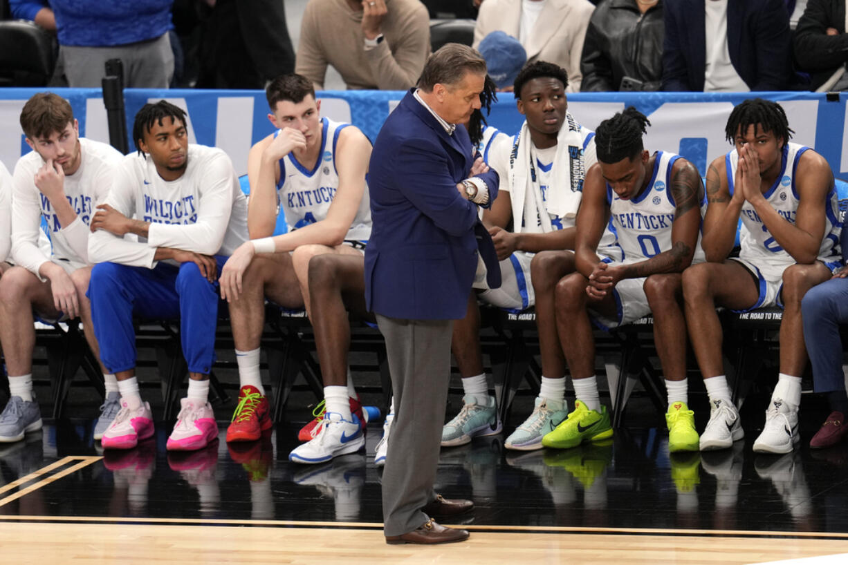 Kentucky coach John Calipari, center, stands in front of the bench late in the second half of the team's basketball game against Oakland in the first round of the men's NCAA Tournament in Pittsburgh, Thursday, March 21, 2024. Oakland won 80-76. (AP Photo/Gene J.