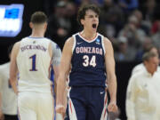 Gonzaga forward Braden Huff (34) reacts after dunking against Kansas during the first half of a second-round college basketball game in the NCAA Tournament in Salt Lake City, Saturday, March 23, 2024.