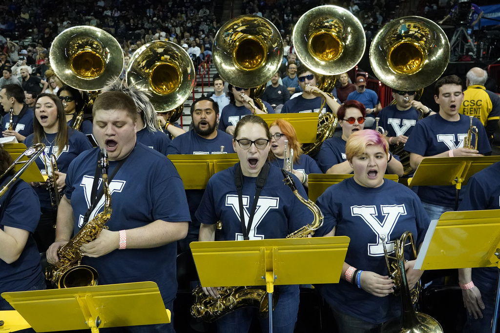 The University of Idaho Marching Band performs the Yale fight song while wearing Yale T-shirts during a time out in the first half of a second-round college basketball game between Yale and San Diego State in the NCAA Tournament in Spokane, Wash., Sunday, March 24, 2024. The Yale band could not make the trip, so the Idaho band learned the fight song and stepped in to support Yale. (AP Photo/Ted S.