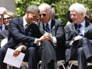 FILE - President Barack Obama, Vice President Joe Biden, and former President Bill Clinton attend at a memorial service for Sen. Robert Byrd, July 2, 2010, at the Capitol in Charleston, W.Va. Former Presidents Barack Obama and Bill Clinton are teaming up with President Joe Biden for a glitzy reelection fundraiser Thursday night at Radio City Music Hall in New York City. The event brings together more than three decades of Democratic leadership.