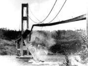 In this Nov. 7, 1940 file photo, a large section of the concrete roadway in the center span of the new Tacoma Narrows Bridge collapses into Puget Sound between Tacoma and the Kitsap Peninsula. Known as "Galloping Gertie," the bridge became famous for twisting and bending like a ribbon before collapsing in a windstorm on Nov. 7, 1940, four months after opening.